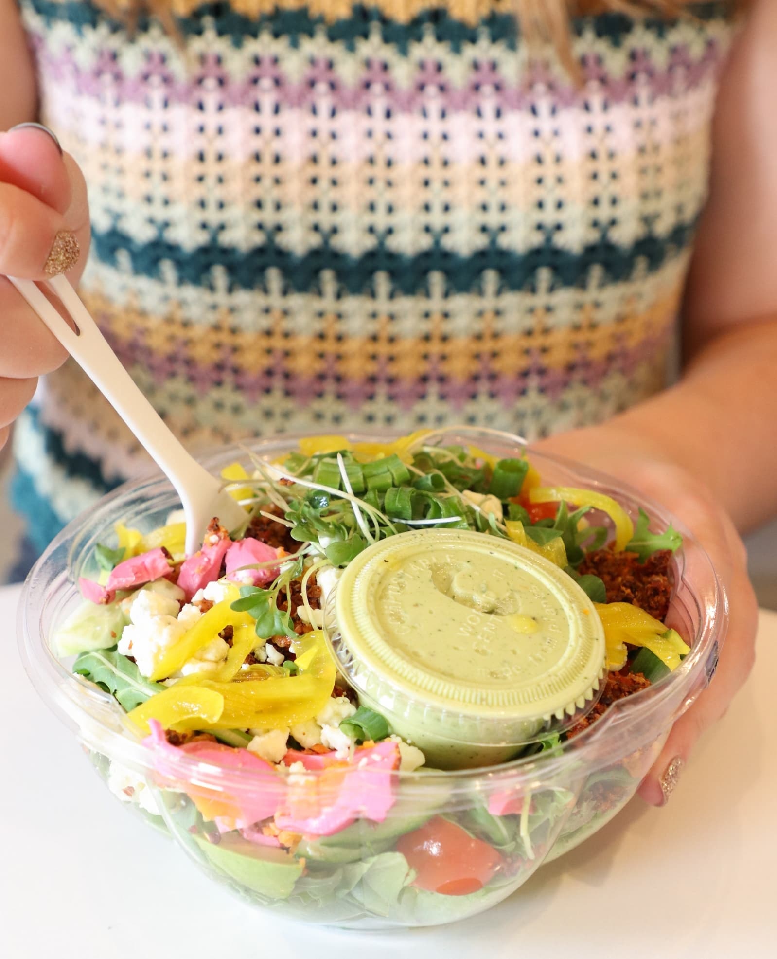 Women Holding Salad Bowl with World Centric Container