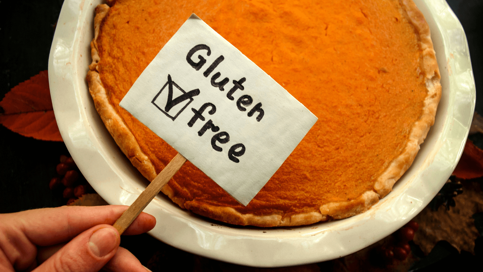 Photo of gluten free pumpkin pie. Autumn decor. Traditional Thanksgiving food.