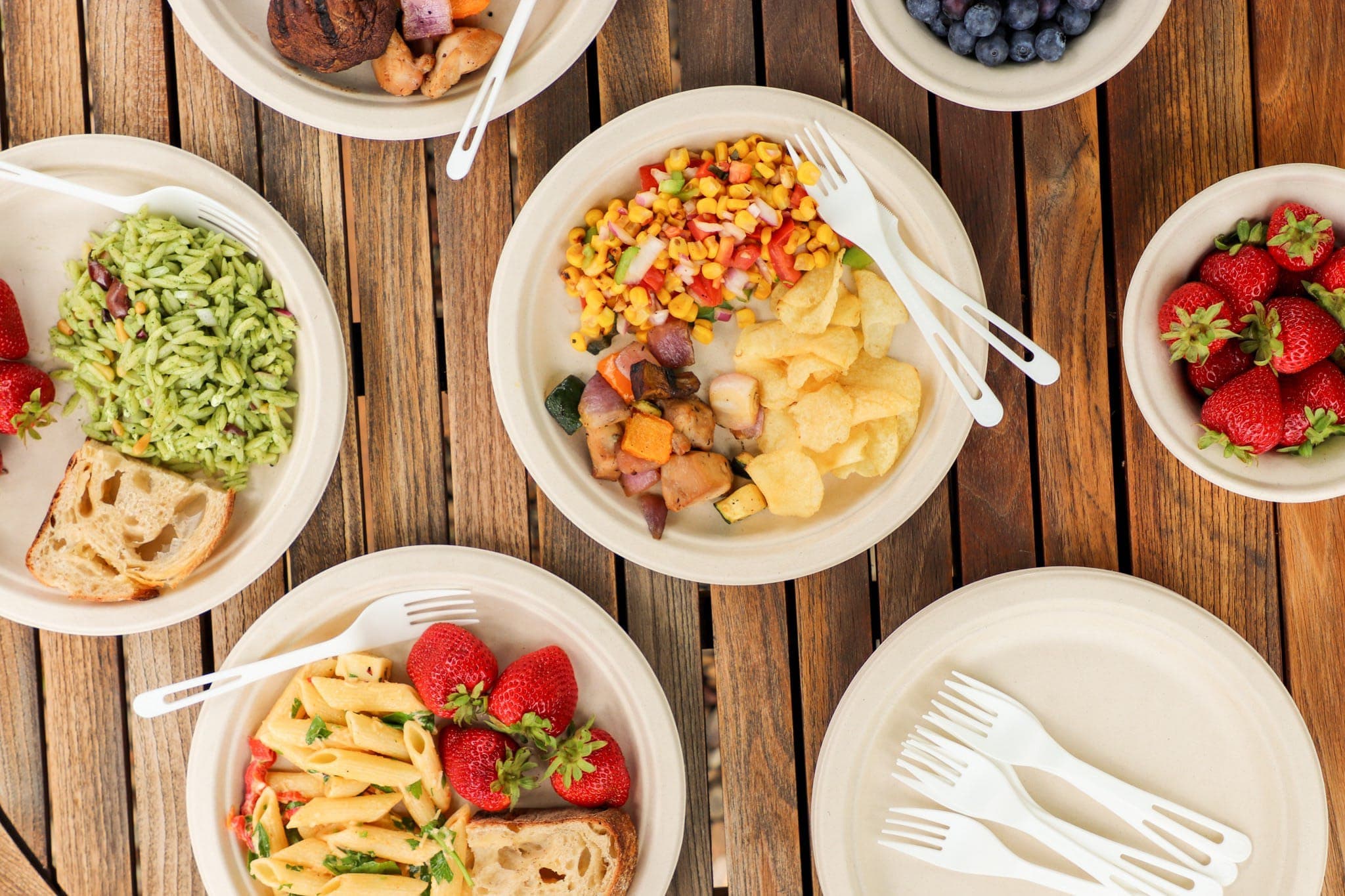 food arranged on biodegradable disposable plates